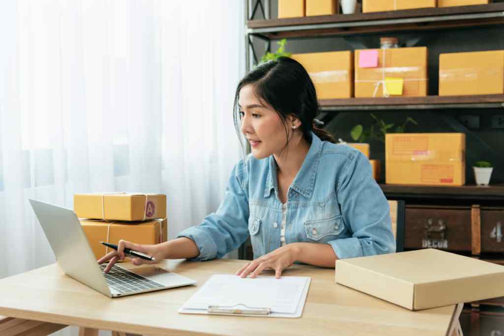 small business owner using order fulfillment strategies
