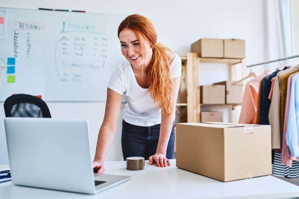 Woman packing ecommerce store orders